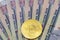 Bitcoin token on top of Dubai, dirham banknotes money