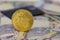 Bitcoin token on top of Dubai, dirham banknotes money with black credit card.