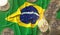 Bitcoin tokens and flag of Brazil. Cryptocurrency related 3D rendering