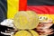 Bitcoins on Belgium and Germany flag background
