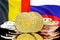 Bitcoins on Belgium and Russia flag background