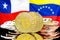 Bitcoins on Chile and Venezuela flag background