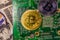 Bitcoins and circuit board on the one hundred dollar bills