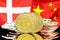 Bitcoins on Denmark and China flag background