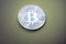 Bitcoins digital virtual money on a green background.