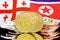 Bitcoins on Georgia and North Korea flag background