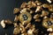 Bitcoins and gold nuggets on black background