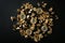 Bitcoins and gold nuggets on black background