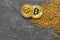 Bitcoins and gold nuggets on grunge background