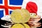 Bitcoins on Iceland and Japan flag background