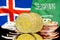 Bitcoins on Iceland and Saudi Arabia flag background