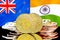 Bitcoins on New Zealand and India flag background