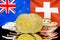 Bitcoins on New Zealand and Switzerland flag background