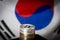 Bitcoins over flag of South Korea