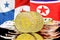 Bitcoins on Panama and North Korea flag background. Concept for investors in cryptocurrency and Blockchain technology in the