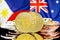 Bitcoins on Philippines and Australia flag background
