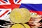 Bitcoins on Russia and United Kingdom flag background