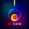 Bitcoins in a soap bubble on blue background.