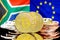 Bitcoins on South Africa and European Union flag background