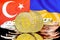 Bitcoins on Turkey and Ukraine flag background