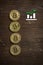 Bitcoins on wooden background with a growing graph icon