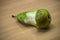 Bitten pear on a wooden table