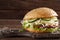 Bitten veggie burger on a wooden background