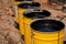 Bitumen mastic in buckets. Protective bitumen mastic for concrete pavement. Material for waterproofing the foundation