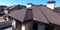 Bituminous tile for a roof. House with a roof from a bituminous tile. a roof from a bituminous tile. Moder