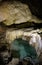 Bizarre and fabulous karst deposits among bowls of turquoise water in the New Athos Cave in Abkhazia