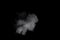 Bizarre forms of white powder explosion cloud against black background