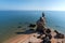 Bizarre rock on the sandy beach of the Azov sea