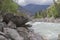 Bizarre stone on the shore of a mountain river. Altai Mountains