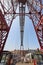 Bizkaia red iron hanging bridge and Nervion river. Euskadi