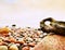 Bizzare rock on the pebbles beach, dramatic sky above. Stony offshore.