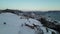 BjÃ¸rnafjorden, Norway - December 14th 2022 â€“ Ascending over snowy pine trees towards the BjÃ¸rnafjord and OsÃ¸yro.