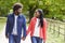 Black adult couple,boyfriend,girlfriend walk holding hands in the countryside,close up