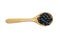 Black adzuki bean on wooden spoon isolated on background.