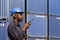 Black african amarican man worker working control loading freight containers at commercial shipping dock. cargo freight dock and