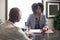 Black African American Female Businesswoman with a Client