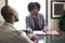 Black African American Female Businesswoman with a Client