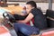 Black African brother and sister enjoying bumper cars