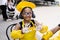 Black african cook child girl showing hands with flour and smile. African child in chefs hat and yellow apron uniform.