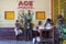 Black African people taking rest inside bus stop in Namibia