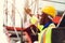 Black African port shipping staff director working in logistic control loading containers at ship cargo for import export goods