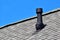 Black air ventilation chimney on roof
