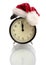 Black alarm clock in a New Year\'s cap