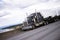 Black american big rig semi truck on interstate highway