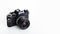 Black analogue camera. Isolated white background. Space for text