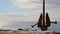 Black Anchor Swinging At Seaside